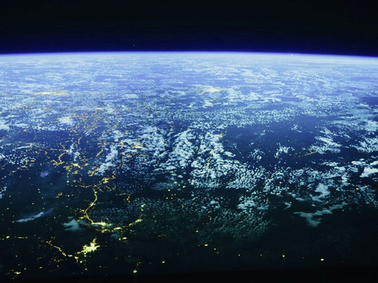 The Earth from space, with city lights at night